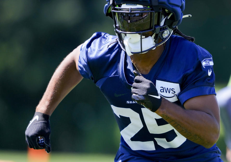 Seattle Seahawks running back Kenny McIntosh runs drills during the NFL football team's training camp Wednesday, July 26, 2023, in Renton, Wash. (AP Photo/Lindsey Wasson)