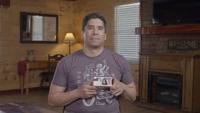 <p>courtesy netflix</p> Frank Gonzales holding a photo of his daughter Libby.