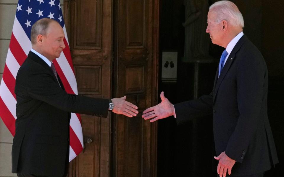 Biden and Putin shake hands - AP Photo/Alexander Zemlianichenko