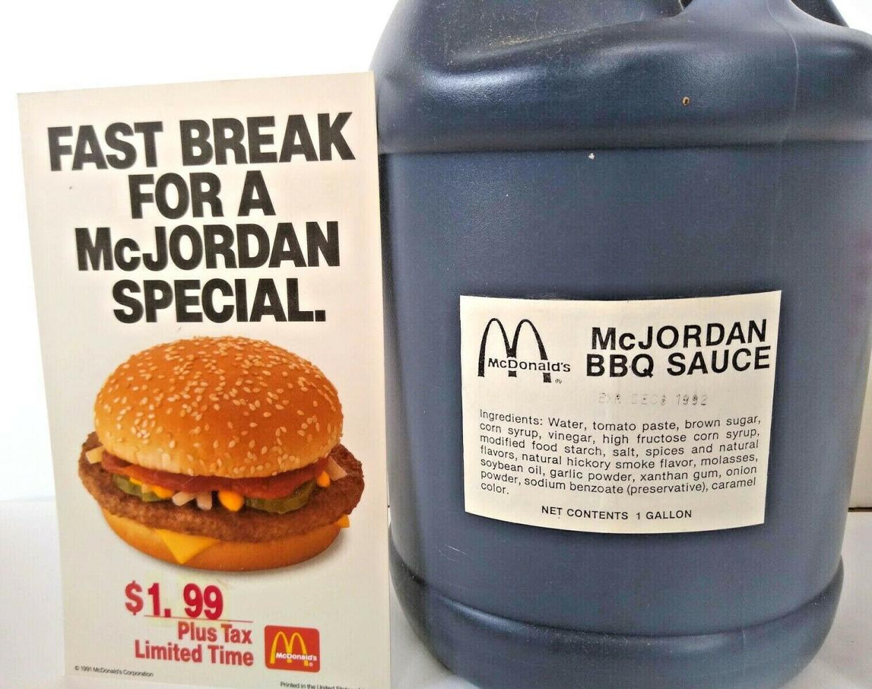 Large container of McJordan BBQ Sauce with an ad for the McJordan special