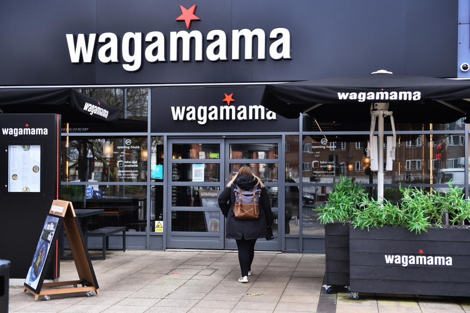 CHEADLE-ENGLAND- MARCH 12: A lady walks to a Wagamama Restaurant store on March 12, 2021 in Cheadle, England. (Photo by Nathan Stirk/Getty Images)