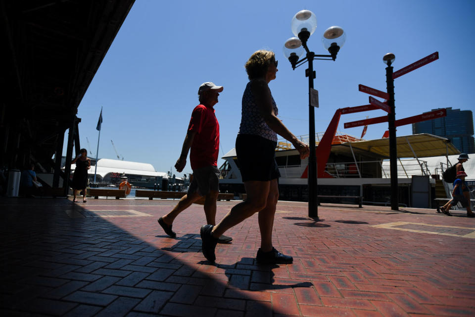 Pedestrians in Sydney’s CBD on Thursday during the heatwave. Source: AAP