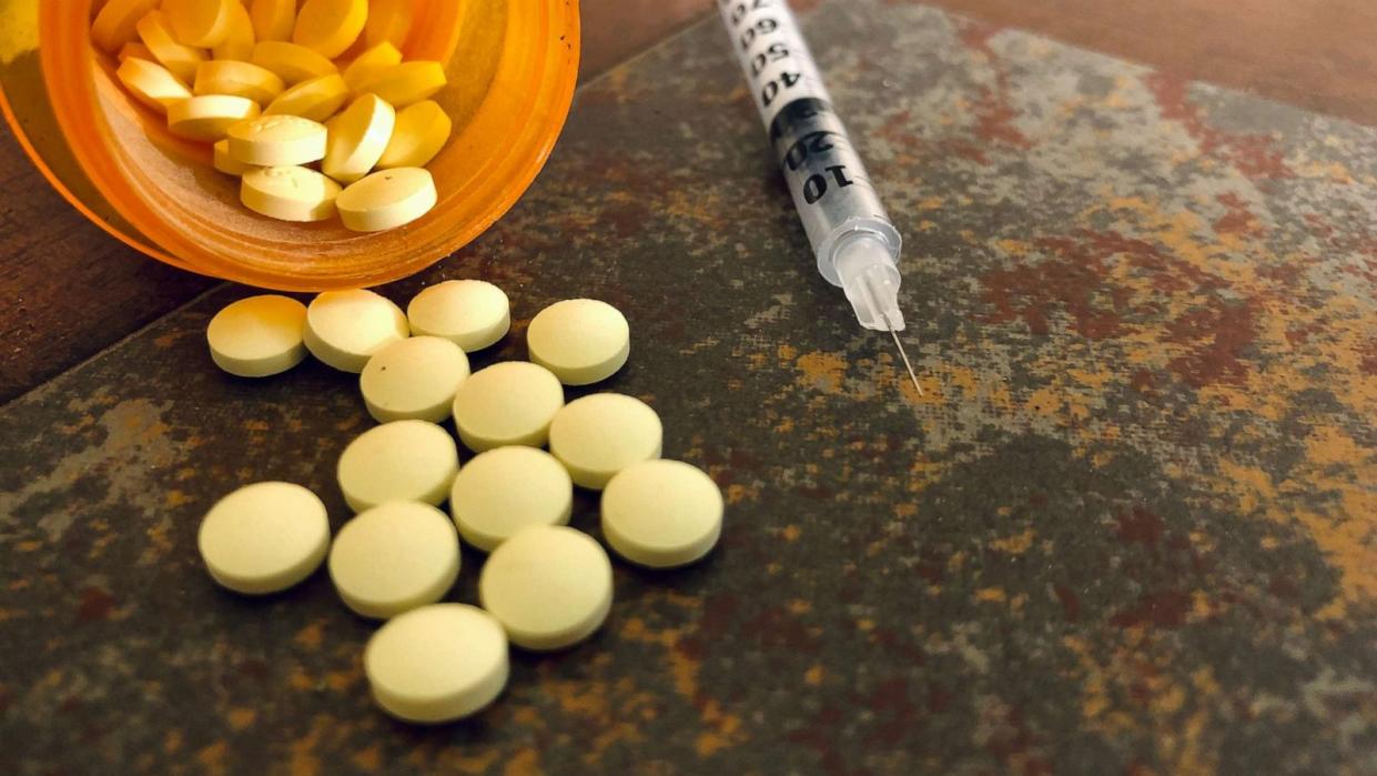 PHOTO: Opioid pills sit next to a syringe in an undated stock image. (STOCK IMAGE/Getty Images)