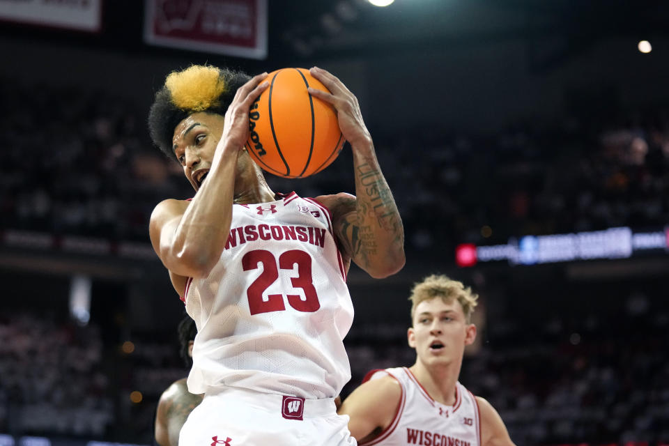 Dec 2, 2023; Madison, Wisconsin, USA; Wisconsin Badgers guard Chucky Hepburn (23) rebounds the ball against the Marquette Golden Eagles during the first half at the Kohl Center. Mandatory Credit: Kayla Wolf-USA TODAY Sports