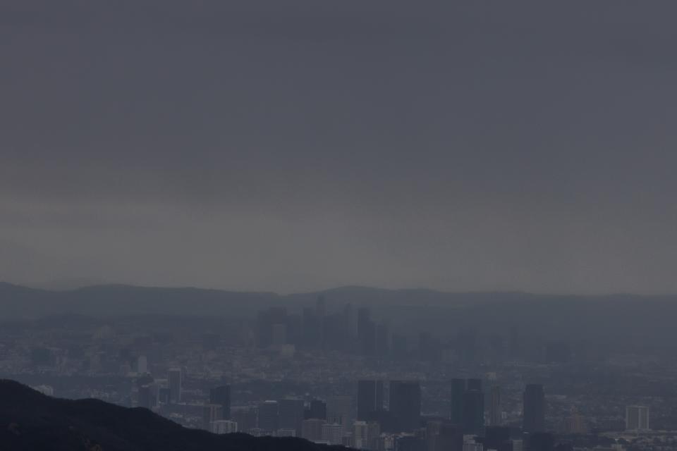 Buildings in Downtown Los Angeles are seeing covered by heaven clouds and rain, seeing in from Topanga, California on February 4, 2024. The US West Coast was getting drenched on February 1 as the first of two powerful storms moved in, part of a "Pineapple Express" weather pattern that was washing out roads and sparking flood warnings. The National Weather Service said "the largest storm of the season" would likely begin on February 4.