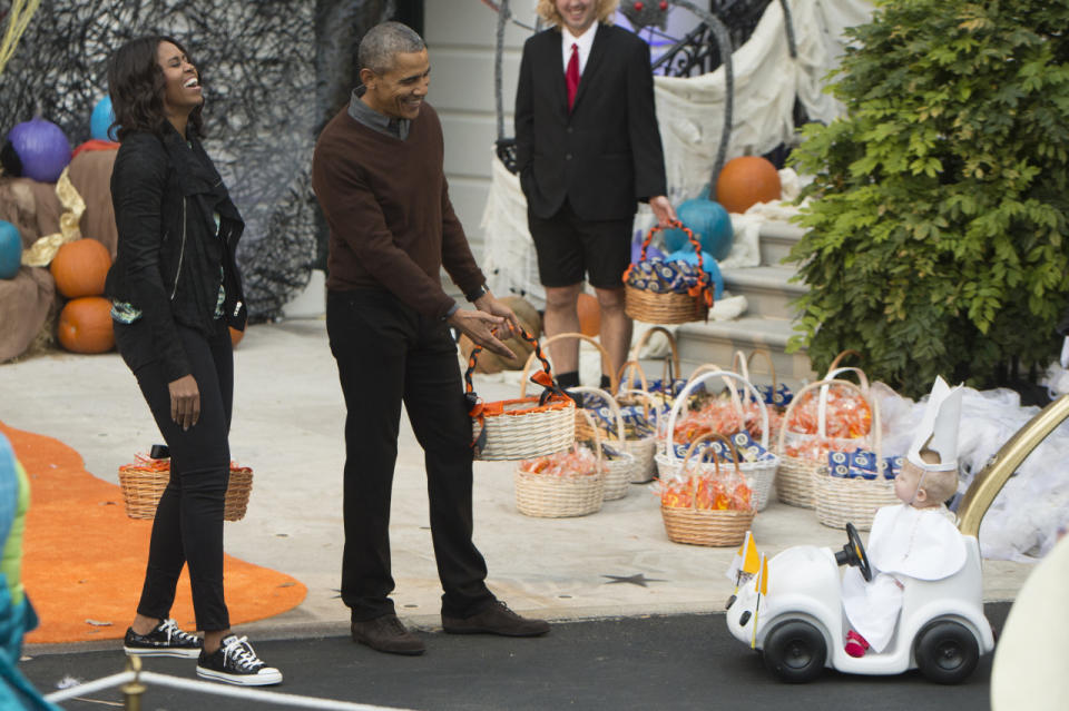 Michelle Obama eschewed a costume and instead wore her casual clothes during Halloween festivities at the South Portico of the White House. 