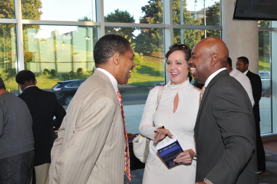 Attorney Robert Spence, left, speaks with attorney Ricky Wilkins. Wilkins died Thursday at 58 years old.