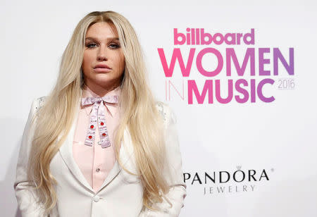 FILE PHOTO: Kesha poses on the red carpet a the Billboard Magazine's 11th annual Women in Music luncheon in New York, U.S., December 9, 2016. REUTERS/Shannon Stapleton/File Photo