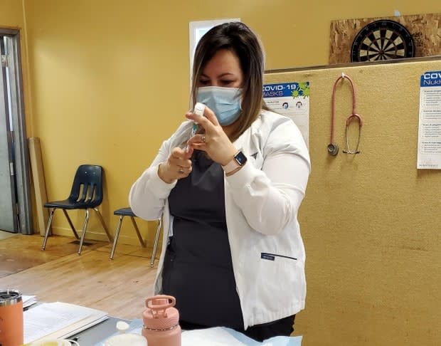 Public health nurse Betty Sampson prepares the first dose of the Moderna COVID-19 vaccine to be administered in Makkovik in January.