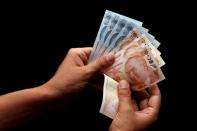 FILE PHOTO: Turkish lira banknotes are seen in this picture illustration in Istanbul