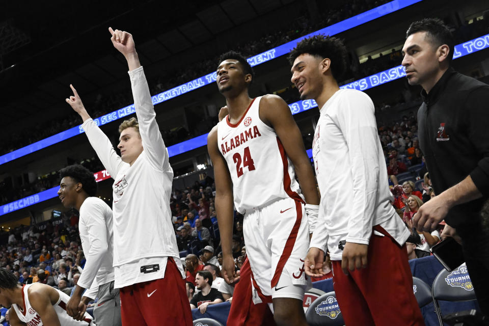 Alabama forward Brandon Miller (24) and teammates stand on the sideline at the close of an NCAA college basketball game against Mississippi State in the third round of the Southeastern Conference tournament, Friday, March 10, 2023, in Nashville, Tenn. Alabama won 72-49. (AP Photo/John Amis)