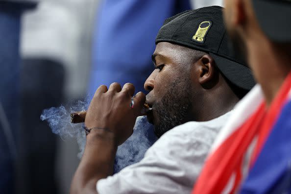 HOUSTON, TEXAS - NOVEMBER 02:  Jorge Soler #12 of the Atlanta Braves celebrates with a cigar following the team's 7-0 victory against the Houston Astros in Game Six to win the 2021 World Series at Minute Maid Park on November 02, 2021 in Houston, Texas. (Photo by Elsa/Getty Images)