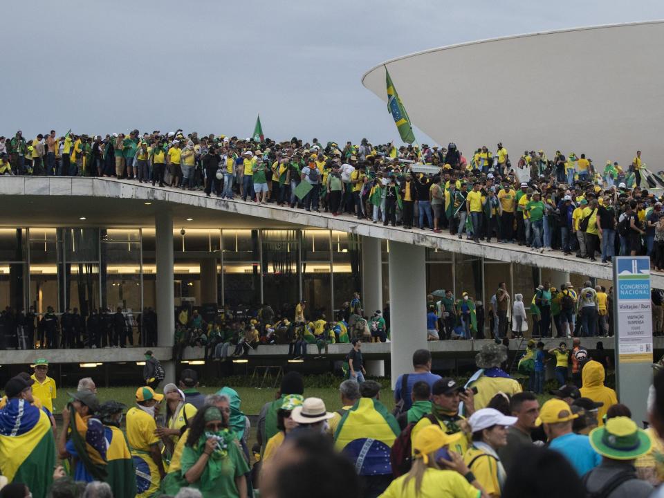 Supporters of former President Jair Bolsonaro were seen climbing onto the roofs of the House of Representatives and Senate buildings