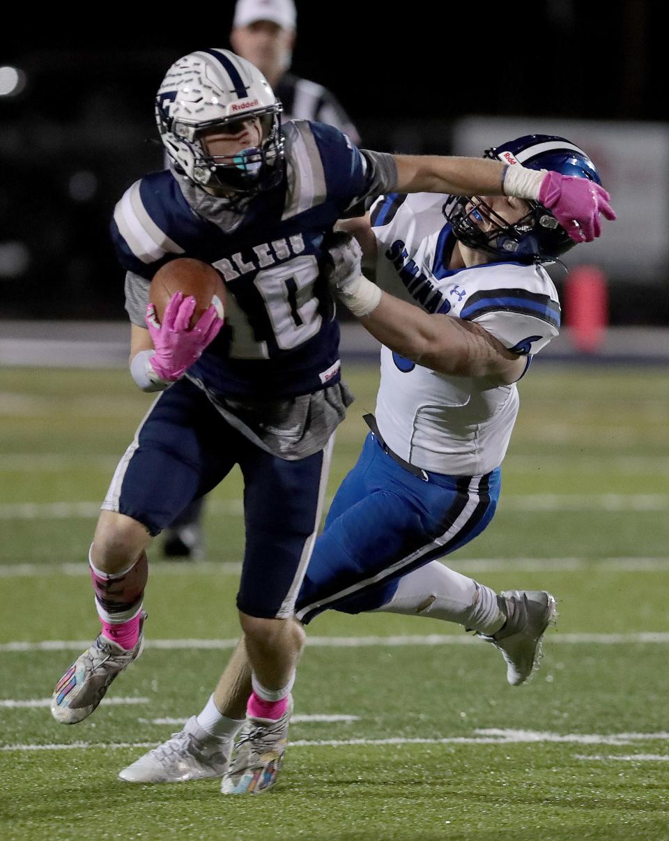 Fairless' Hunter Campbell breaks the tackle of Poland defender Dom Parker in the second half at Fairless.