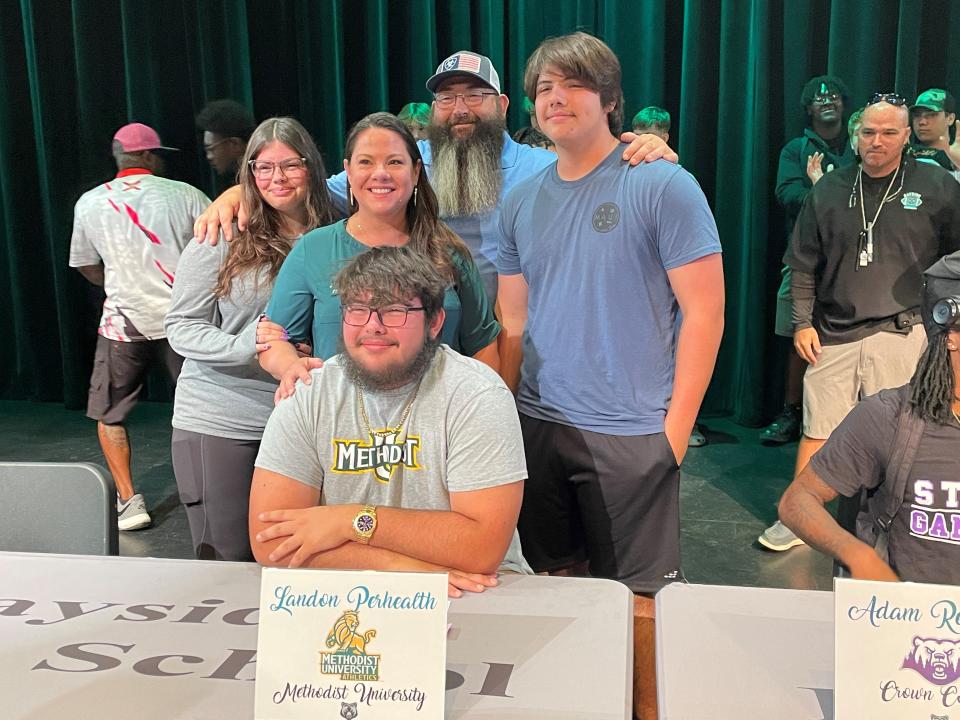 Family members joined Landon Perhealth after he signed at Bayside High on Friday, April 5, 2024.