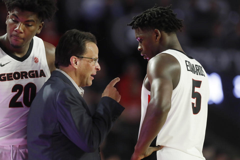 Georgia coach Tom Crean speaks with Georgia's Anthony Edwards (5) during the team's NCAA college basketball game against Tennessee on Wednesday, Jan. 15, 2020, in Athens, Ga. (Joshua L. Jones/Athens Banner-Herald via AP)