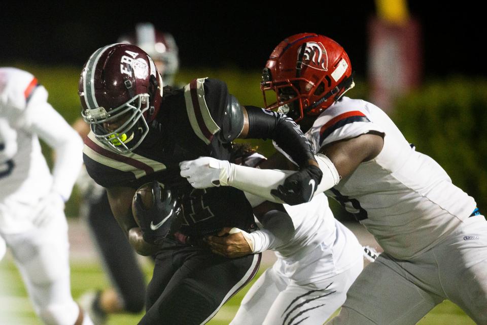 First Baptist Academy's Olsen Henry (11) runs the ball during the Class 2A football state semifinal between First Baptist Academy and Champagnat Catholic on Friday, Dec. 3, 2021 at First Baptist Academy in Naples, Fla. 