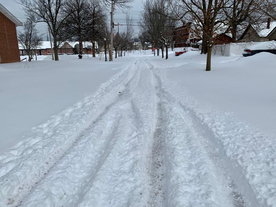 This side street was covered in snow in the late morning on Monday, Jan. 17, 2022, after a major winter storm dumped several inches of snow on Akron the overnight.