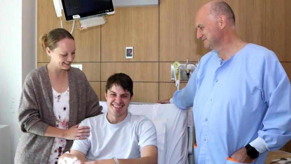 Dane Brockmann (centre) recovers alongside Berni and Dr Mark Dexter (right). Picture: Supplied