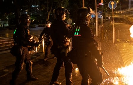 Molotov cocktail bursts after it was thrown by a demonstrator at police officers during a protest in Hong Kong