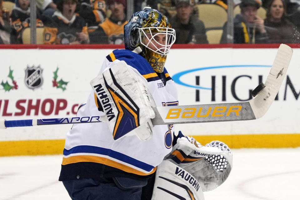 St. Louis Blues goaltender Thomas Greiss blocks a shot during the second period of the team's NHL hockey game against the Pittsburgh Penguins in Pittsburgh, Saturday, Dec. 3, 2022. (AP Photo/Gene J. Puskar)