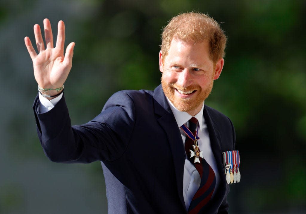 Prince Harry waving.