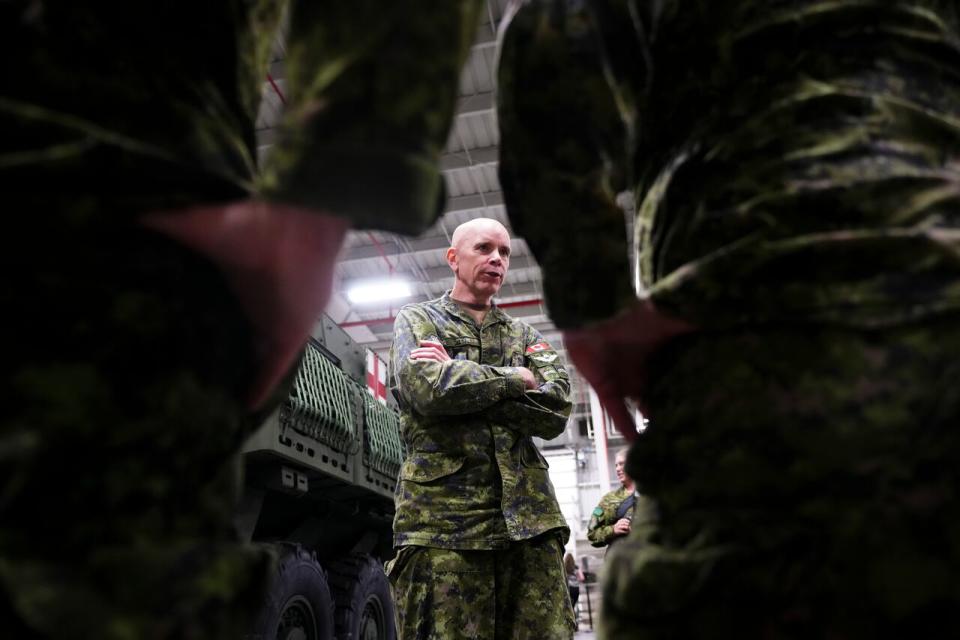 Chief of the Defence Staff Gen. Wayne Eyre talks to his troops as he takes part in an announcement regarding the arrival of new ambulance variants to the armoured combat support vehicle fleet at Garrison Petawawa in Petawawa, Ont., on Thursday, Oct. 19, 2023.