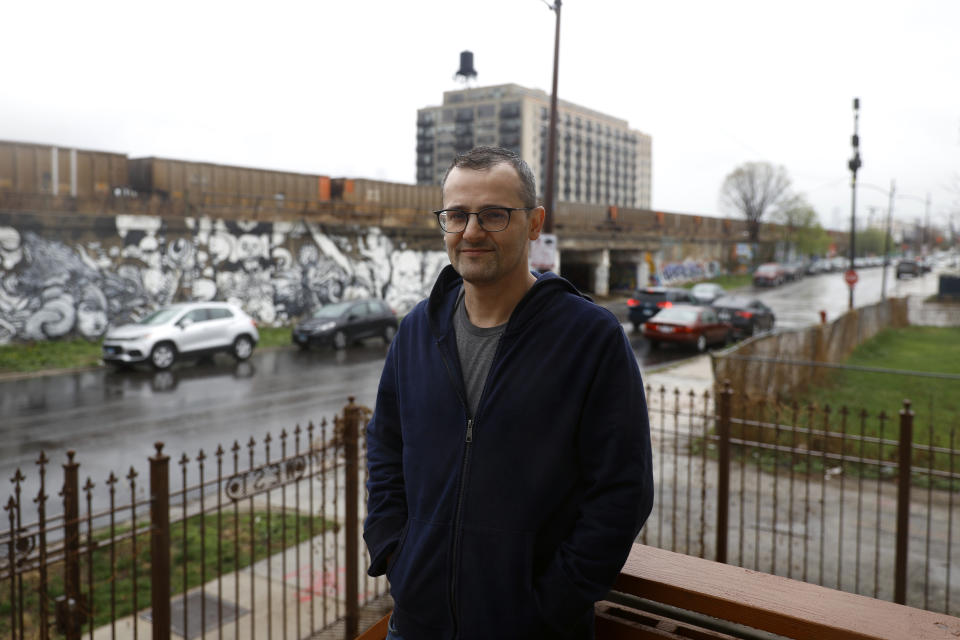 Troy Hernandez, environmental justice activist with Pilsen Environmental Rights and Reform Organization poses for a portrait on Friday, April 9, 2021 in Chicago's Pilsen neighborhood. President Joe Biden’s proposal to get rid of every lead water pipe in the country could have huge ramifications. That's especially true in communities where a large number of Black, Latino and low-income residents have been left effectively drinking from a lead straw. The problem persists decades after scientists established that lead consumption is unsafe at any level. Biden announced the pipe proposal as part of his $2.3 trillion infrastructure package. (AP Photo/Shafkat Anowar)