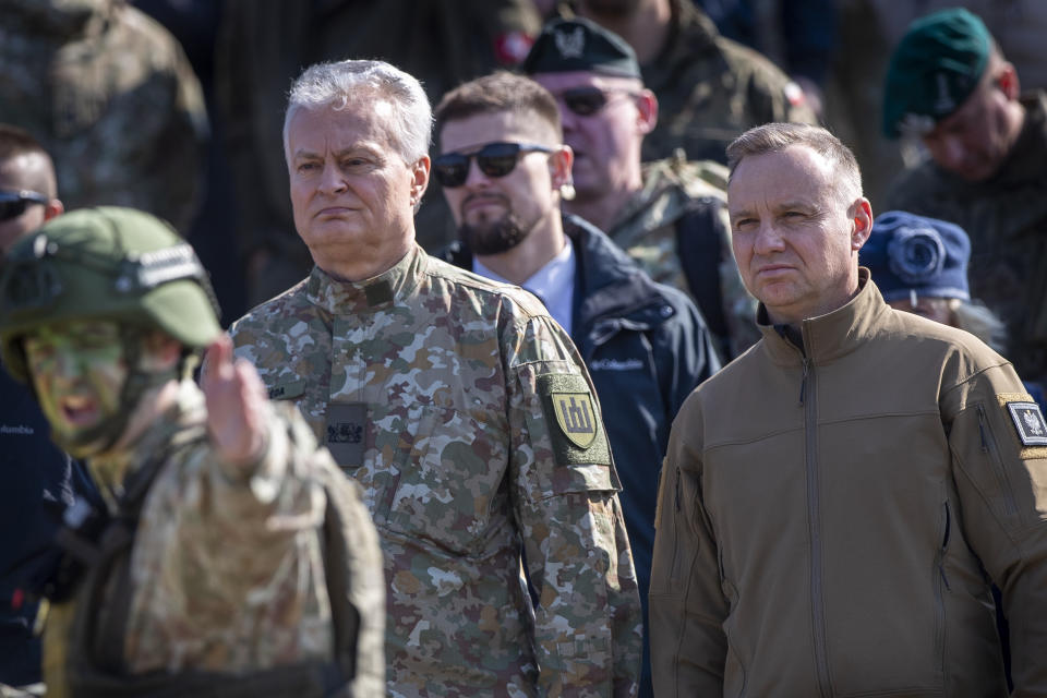 Lithuania's President Gitanas Nausedas and Poland's President Andrej Duda, right, attend a Lithuanian-Polish Brave Griffin 24/II military exercise near the Suwalki Gap near the Polish border at the Dirmiskes village, Alytus district west of the capital Vilnius in Lithuania on Friday, April 26, 2024. Over 1500 troops and 200 pieces of tactical equipment are rehearsing defence scenarios under the bilateral Lithuanian-Polish Orsha Plan near the Suwalki Gap. (AP Photo/Mindaugas Kulbis)