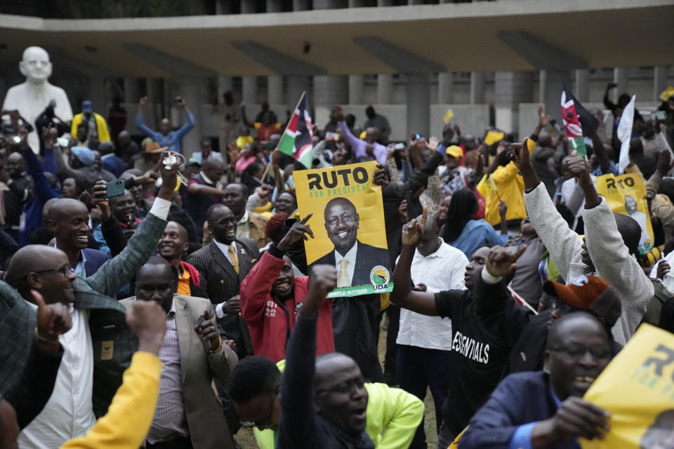 Supporters of Kenyan Deputy President William Ruto celebrate at his party headquarters in Nairobi, Kenya, Monday, Aug. 15, 2022. Kenya’s electoral commission chairman has declared Deputy President William Ruto the winner of the close presidential election over five-time contender Raila Odinga, a triumph for the man who shook up politics by appealing to struggling Kenyans on economic terms and not on traditional ethnic ones. (AP Photo/Mosa'ab Elshamy)