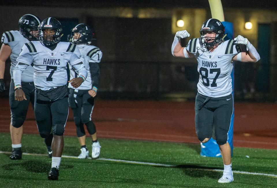 Bellingham High School sophomore Wyatt Callery , right, celebrates his winning touchdown on a direct snap, against Ashland, Sept. 29, 2023. At left is senior quarterback Dasha Domercant, #7.