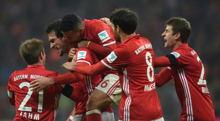 Bayern Munich's defender Mats Hummels (2nd L) celebrates scoring with his teammates during the German first division Bundesliga football match against Bayer 04 Leverkusen November 26, 2016