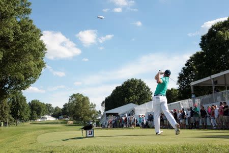 Jun 30, 2016; Akron, OH, USA; Jordan Spieth of the United States hits a tee shot on the seventeenth hole at Firestone Country Club - South Course. Mandatory Credit: Charles LeClaire-USA TODAY Sports