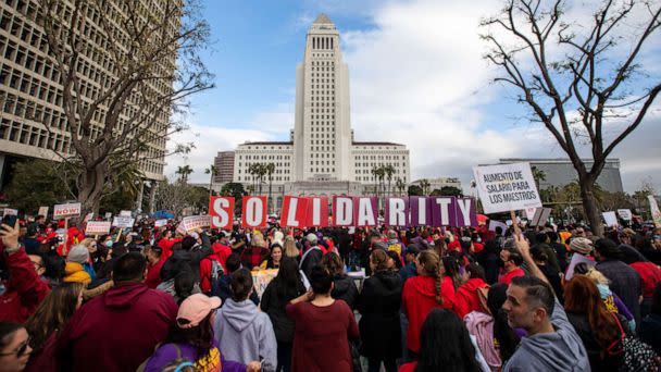 PHOTO: United Teachers of Los Angeles and SEIU 99 members hold a joint rally at Grand Park in front of City Hall in a show of solidarity, Mar. 15, 2023, in Los Angeles. (Francine Orr/Los Angeles Times via Getty Imag)
