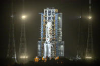 A Long March-5 rocket sits on the launch pad at the Wenchang Space Launch Center in Wenchang in southern China's Hainan Province, early Tuesday, Nov. 24, 2020. Chinese technicians are making final preparations for a mission to bring back material from the moon's surface for the first time in more than four decades, an undertaking that could boost human understanding of the moon and of the solar system more generally. (AP Photo/Mark Schiefelbein)