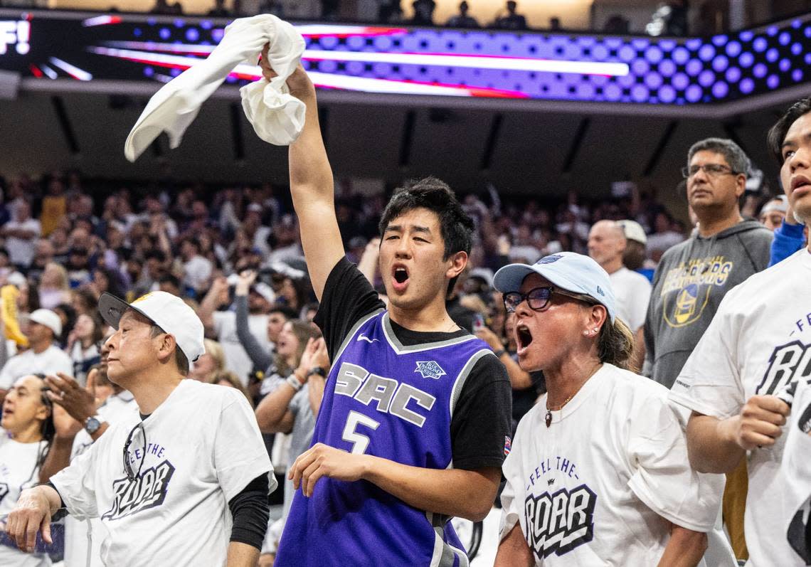 Chad Wong and his mother Flo Ito Wong of Sacramento cheer on the Sacramento Kings during an NBA play-in game against the Golden State Warriors at Golden 1 Center on Tuesday, April 16, 2024.