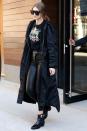 <p>In a Power Rangers t-shirt under a black hooded sweatshirt and long windbreaker jacket with Paige leather pants, Tommy Hilfiger ankle boots and Quay oversized sunglasses while out in New York City. </p>