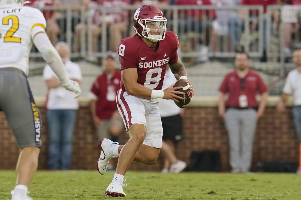 Oklahoma quarterback Dillon Gabriel (8) scrambles with the ball in the first half of an NCAA college football game against Kent State, Saturday, Sept. 10, 2022, in Norman, Okla. (AP Photo/Sue Ogrocki)