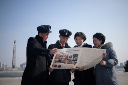 North Korean students read newspaper coverage of Kim Jong Un's summit with US President Donald Trump