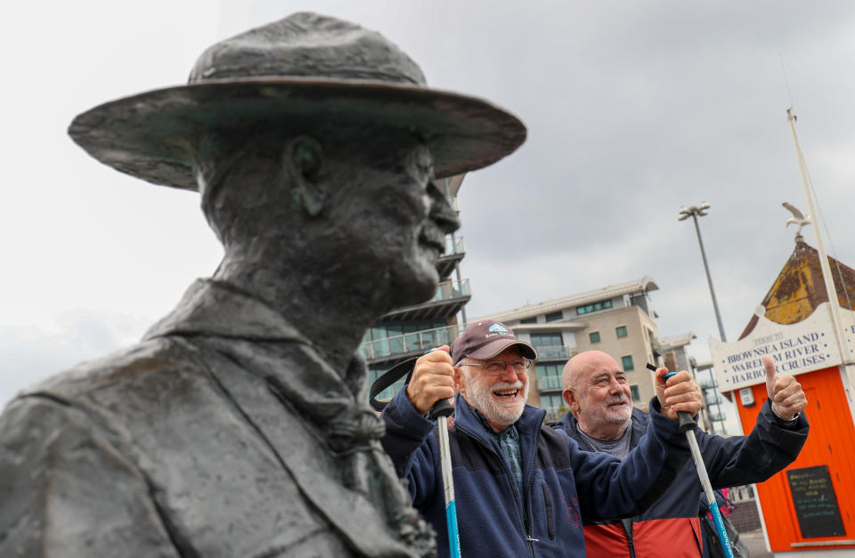 Local resident Len Banister (2nd right) shows his support for a statue of Robert Baden-Powell on Poole Quay in Dorset ahead of its expected removal to "safe storage" following concerns about his actions while in the military and "Nazi sympathies". The action follows a raft of Black Lives Matter protests across the UK, sparked by the death of George Floyd, who was killed on May 25 while in police custody in the US city of Minneapolis.