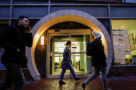 People walk in front of the 123 Baxter St. building in New York City, New York, U.S., February 17, 2018. Picture taken February 17, 2018. REUTERS/Eduardo Munoz