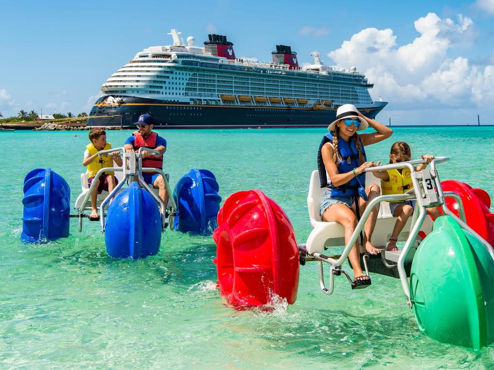 "Dancing with the Stars" alum William Levy, actress Elizabeth Gutiérrez and their children, Christopher, age 10, and Kailey, age 6, ride water tricycles in the tropical waters of Disneys private island in the Bahamas, Castaway Cay.