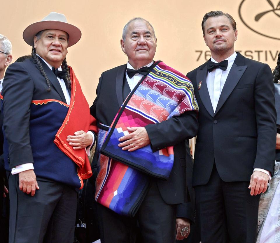 From left, Osage actor Yancey Red Corn, Osage Nation Chief Geoffrey Standing Bear and Leonardo DiCaprio arrive at the May 20 Cannes Film Festival premiere of "Killers of the Flower Moon" in France.