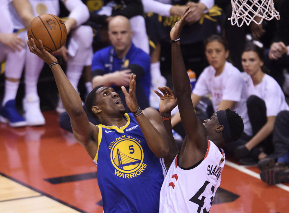 Golden State Warriors centre Kevon Looney (5) drives to the net against Toronto Raptors forward Pascal Siakam (43) during first half basketball action in Game 1 of the NBA Finals in Toronto on Thursday, May 30, 2019. (Nathan Denette/The Canadian Press via AP)