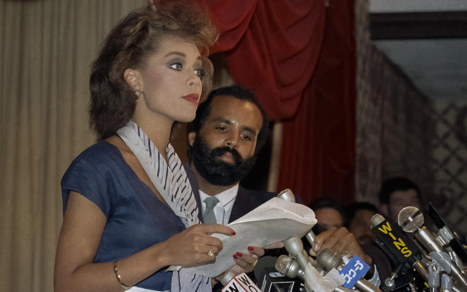 FILE - Vanessa Williams, the first Black woman to win the Miss America crown, in 1984, speaks at a news conference to announce she would relinquish her title over a nude photo scandal, July 23, 1984. The Miss America organization, which apologized to Williams in 2015 over the resignation, is marking its 100th anniversary on Thursday, Dec. 16, 2021, having managed to maintain a complicated spot in American culture. (AP Photo/File)
