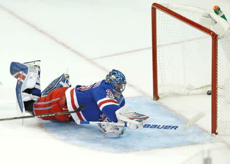 A shot by Pittsburgh Penguins center Evgeni Malkin gets by New York Rangers goalie Henrik Lundqvist to win the game in overtime at Madison Square Garden. Noah K. Murray-USA TODAY Sports