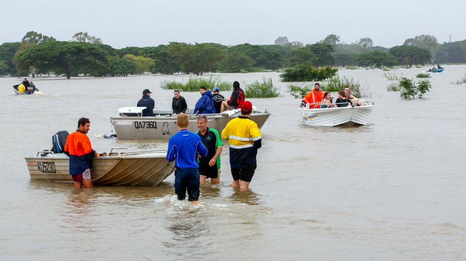 Flood-affected people are evacuated from Townsville earlier this week. Source: Getty