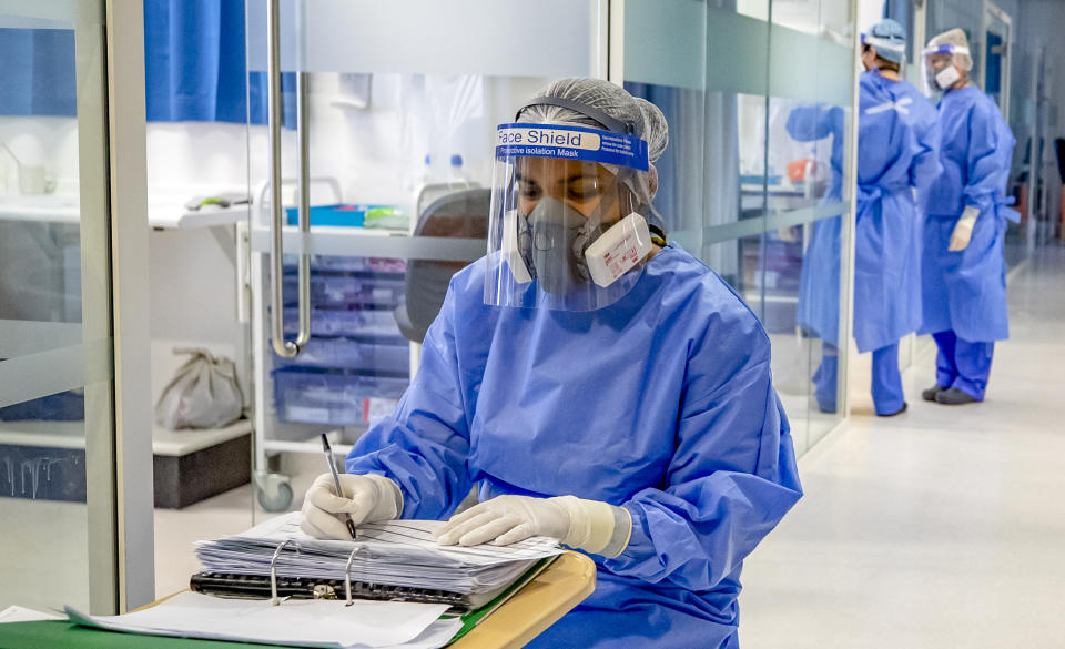 Health workers wearing full personal protective equipment (PPE) on the intensive care unit (ICU) at Whiston Hospital in Merseyside as they continue deal with the increasing number of coronavirus patients. (Photo by Peter Byrne/PA Images via Getty Images)