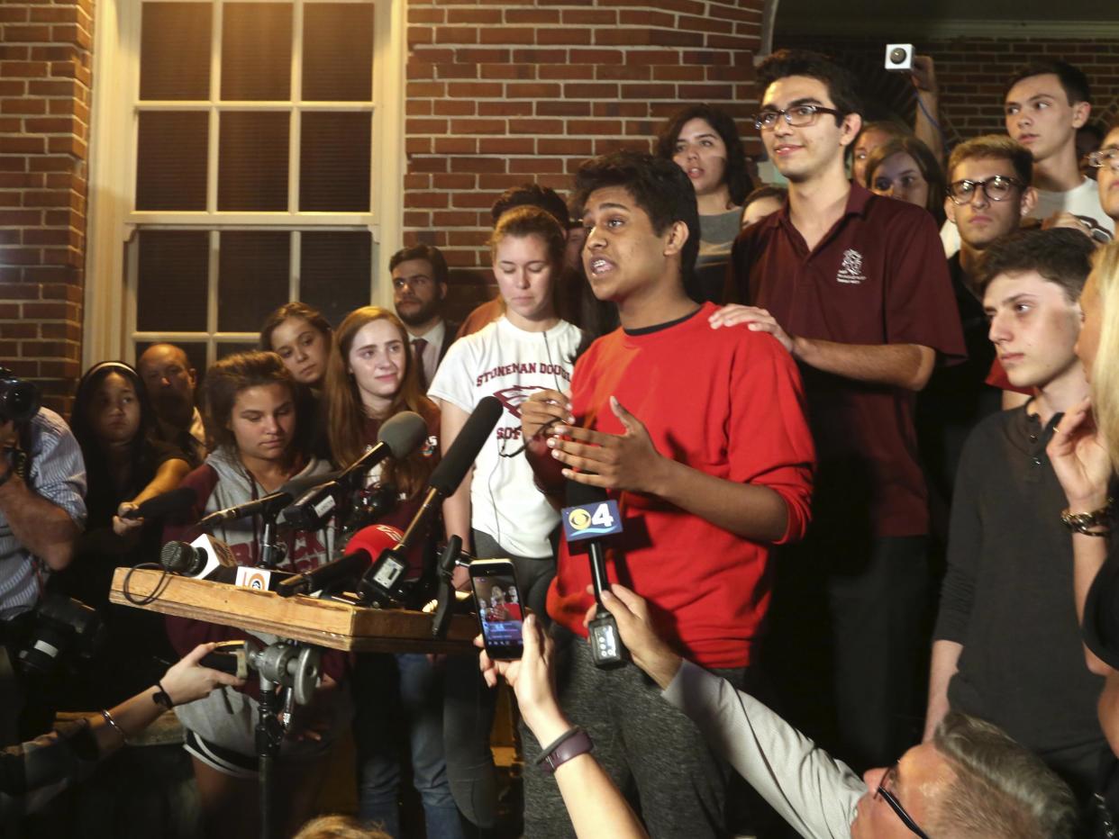 Tanzil Philip, 16, a student survivor from Marjory Stoneman Douglas High School, where 17 students and faculty were killed in a mass shooting on Wednesday, speaks to a crowd of supporters and media as they arrive at Leon High School, in Tallahassee: AP