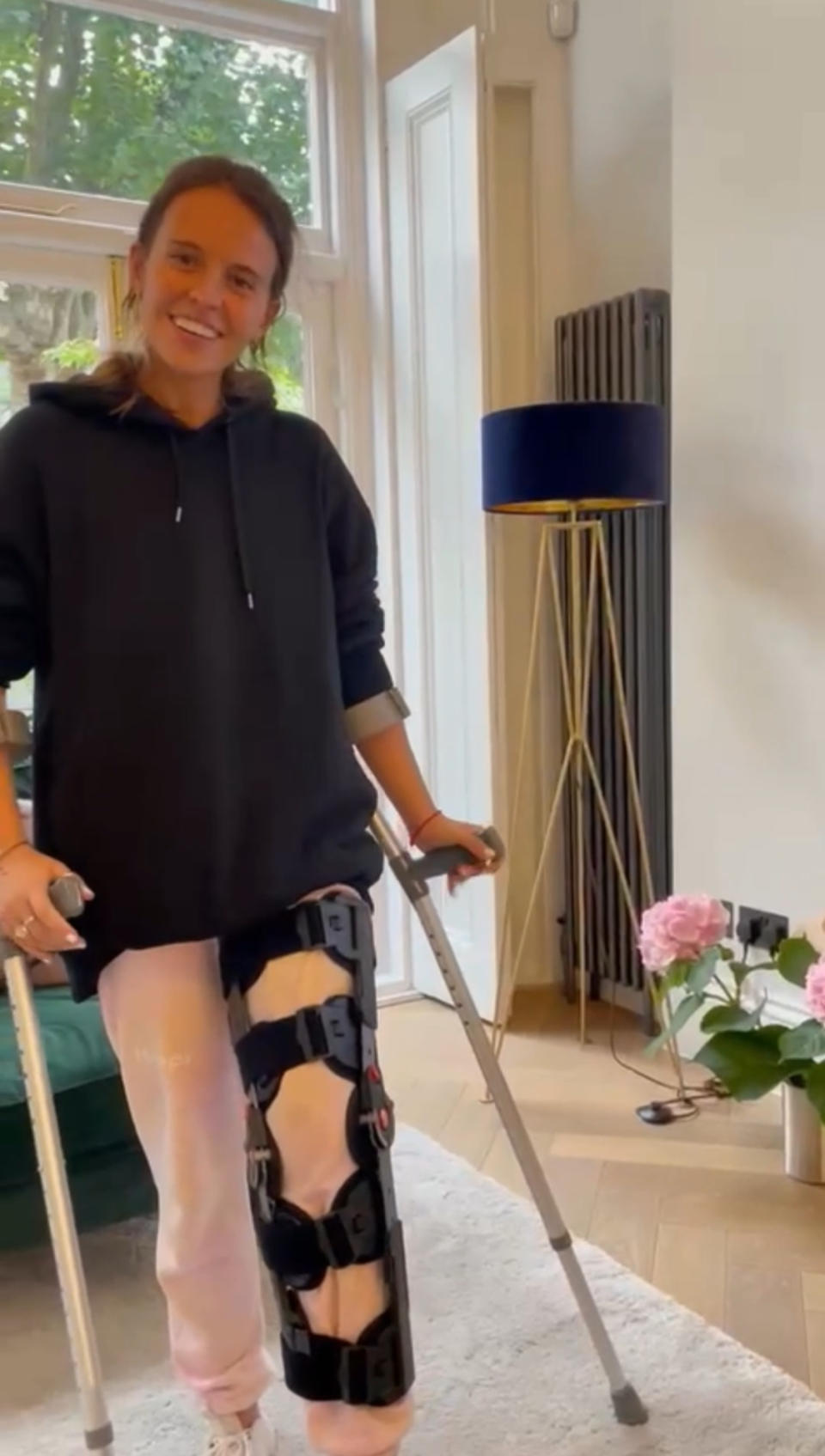 Lazarus on crutches during her recovery in 2022. (Talia Lazarus/SWNS)